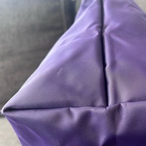 Longchamp tote in purple. Good condition .Zipper works good. Snap button work .